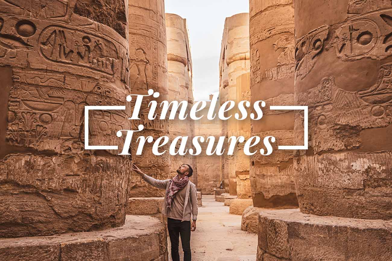 Family Travel Expert For International Travel shares timeless treasures with man standing in a site in Egypt